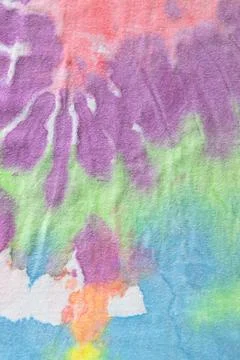 Pastel tie dye, a handmade pattern on a cotton t-shirt. Close-up, top view. D Stock Photos