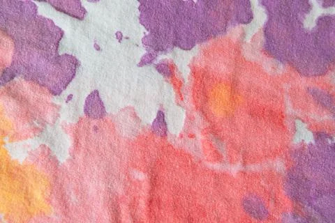 Pastel tie dye, a handmade pattern on a cotton t-shirt. Close-up, top view. D Foto stock