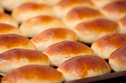 Pasties on baking tray Stock Photos