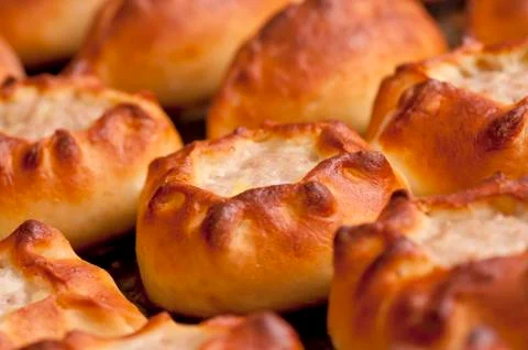 Pasties on baking tray Stock Photos