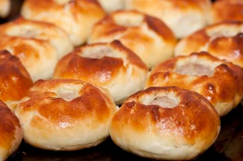 Pasties on baking tray Stock Photos