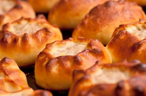 Pasties on baking tray Stock Photos