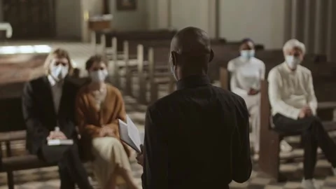 Pastor Delivers Sermon to Congregation During Health Precautions Stock Footage 320587044