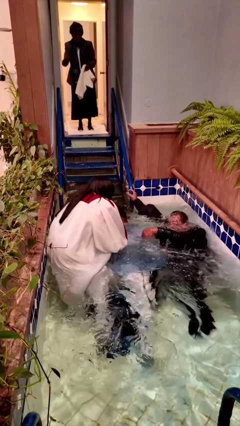 Pastor Falls Into Water During Baptism, Richmond, California, USA - 01 Jan 2025 Stock Footage 337550800