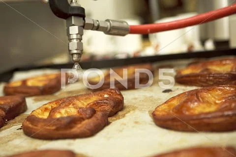 Pastries being sprayed with water Stock Photos