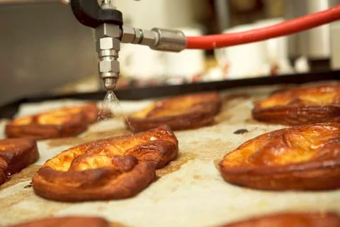 Pastries being sprayed with water Stock Photos