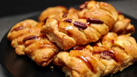 Pastries With Roasted Pecan And Maple Syrup On The Black Plate On The Black Back Stock Footage 149874475