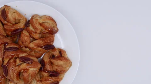 Pastries With Roasted Pecan And Maple Syrup Spinning On The White Plate On The B Stock Footage 149876035