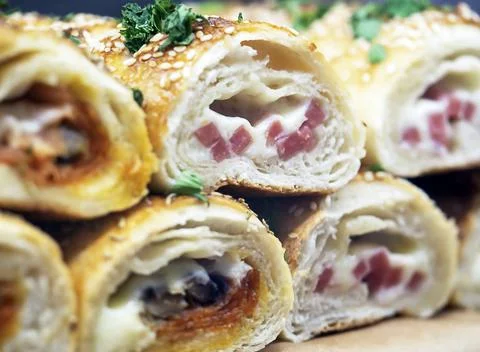 Pastries, rolls with different stuffing. Stock Photos
