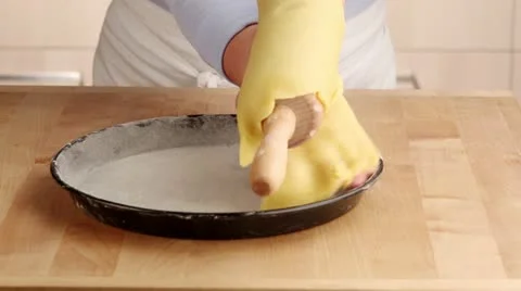 Pastry being placed in a quiche dish Stock Footage 24670125