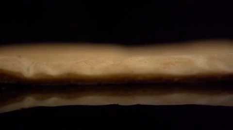 Pastry on black background 库存影片 64702412