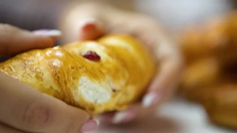 The pastry chef breaks a bun with jam in half. Croissant Stock Footage 124273292