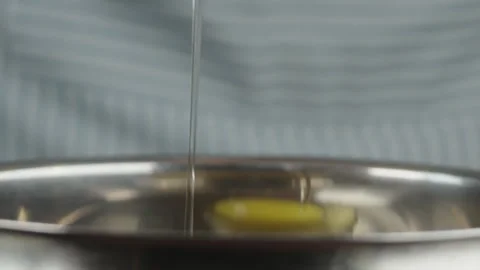 Pastry chef breaks eggs into dishes to beat them with sugar to make a biscuit Stock Footage 286306372