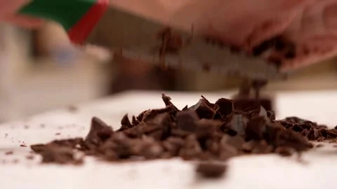 The pastry chef chops the chocolate Stock Footage 276259320