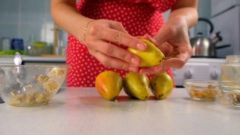 Pastry chef connects halves pears with nuts filling cooking dessert on kitchen. Video stock 313039138