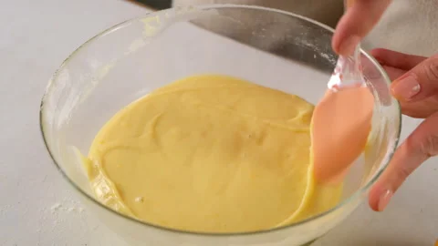 Pastry chef cooking pie batter mixing ingredients in glass bowl with spatula. Video stock 317234771