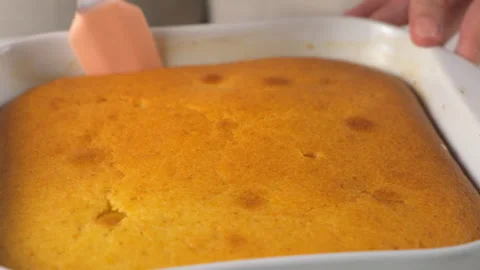 Pastry chef cooking separating tangerine sponge cake pie from baking pan. Stock Footage 317235487
