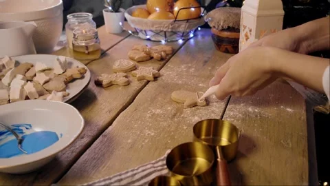 Pastry chef creates New Year's gingerbread cookies, decorating them in various 스톡 동영상 294609721