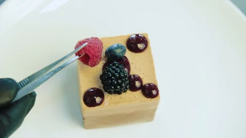 Pastry chef decorating with berries pie pastry Stock Footage 112948170
