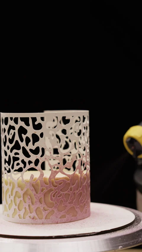 Pastry Chef Decorating Cake with Airbrush Using Zebra Stencil Video stock 306464879