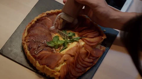 Pastry chef decorating delicious apple tart with chocolate syrup Stock-Footage 333799250