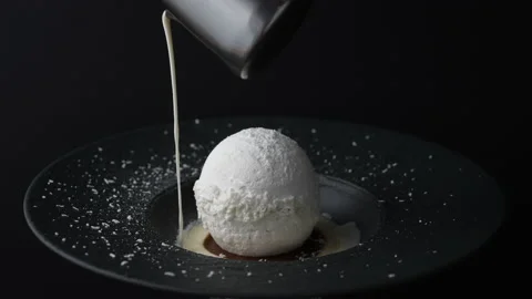 Pastry chef decorating the dessert with sweet vanilla cream sauce Stock Footage 171512152