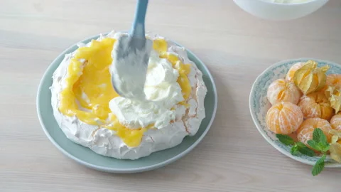 Pastry chef decorating meringue-based dessert named after the Russian ballerina  Stock-Footage 165998416