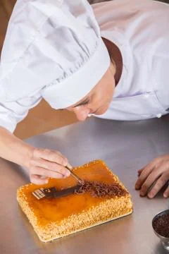 Pastry chef decorating Stock-Fotos