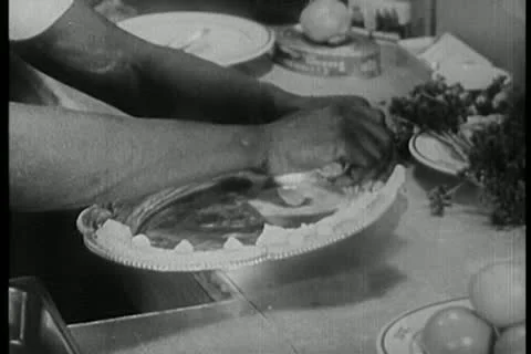 Pastry chef decorating silver platter with butter cream Stock Footage 11356248