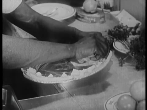 Pastry chef decorating silver platter with butter cream Stock Footage 260253621