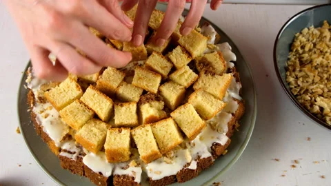 Pastry chef hands cooking arranging small chocolate and vanilla cake cubes. Stock Footage 311537532
