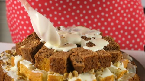 Pastry chef hands cooking pouring white cream on chocolate vanilla cake cubes. Stock-Footage 311538366