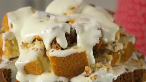 Pastry chef hands cooking pouring white cream on chocolate vanilla cake cubes. Video stock 311539012