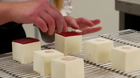 Pastry chef in the kitchen decorating a cake of candies. Stock Footage 96166201