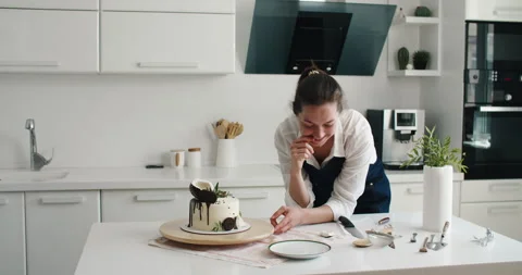 Pastry chef in the kitchen makes cake. Cooking at home. Delicious and beautiful Stock Footage 167353888
