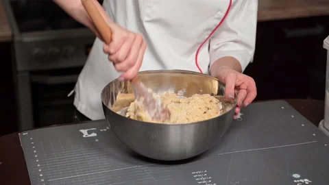 Pastry chef kneads shortbread dough to prepare confectionery for new year. Stock Footage 166436192