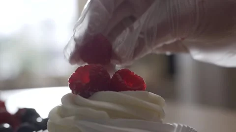 The pastry chef makes final decorations before serving a cake extreme Video stock 130356652