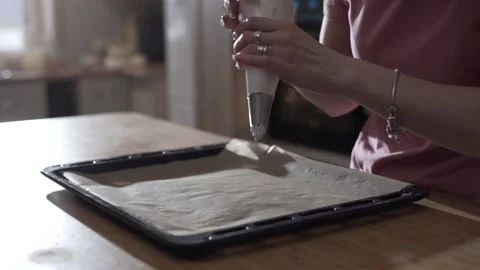The pastry chef makes meringues on the baking paper close up Video stock 130356673