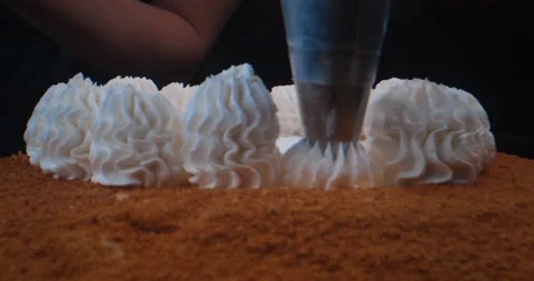 Pastry chef makes a three-tier cake. Cake decorating process. Stock Footage 231529677