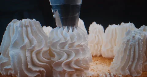 Pastry chef makes a three-tier cake. Cake decorating process. Stock Footage 231530055