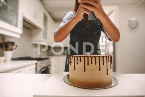 Pastry chef making a delicious cake Stock Photos