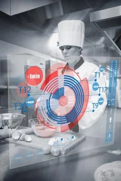 Pastry chef making dough while consulting futuristic interface in black and Stock Photos