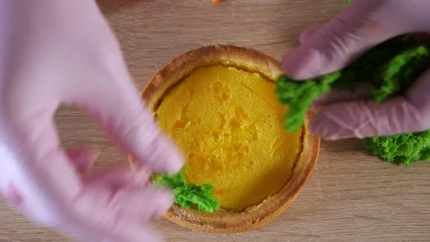 Pastry chef is making mini cake with cream and strawberry slices. Stock Footage 107178343