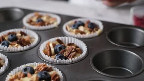 Pastry chef making mixed berry muffin with almond and nut. Stock Footage 141487759