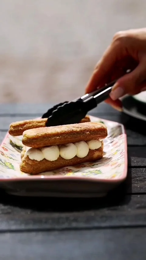 Pastry chef making tiramisu and woman eating it at outdoor cafe 스톡 동영상 341578720