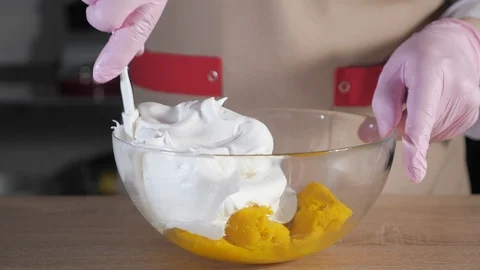 Pastry chef is making yellow macaroons dough. Stock Footage 106003661