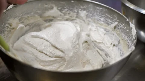 Pastry chef mixing dough with spoon in bowl in kitchen. preparing homemade Stock Footage 309311762