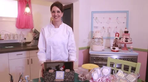 Pastry chef picks a box with cake Stock Footage 61872692