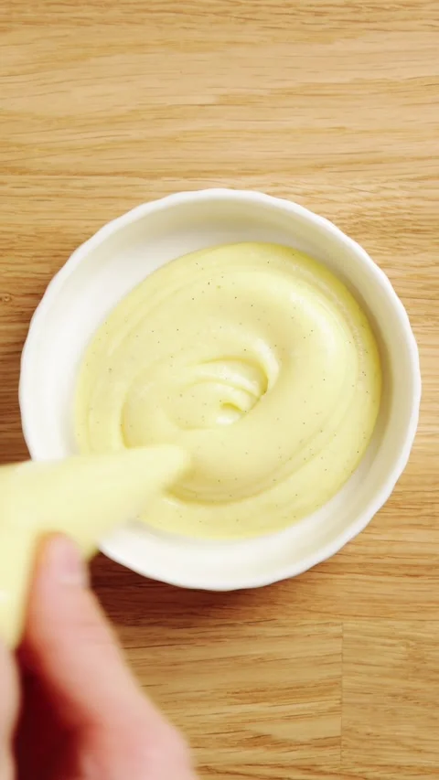 Pastry chef pipes custard from bag into ramekin. Stock Footage 345273965