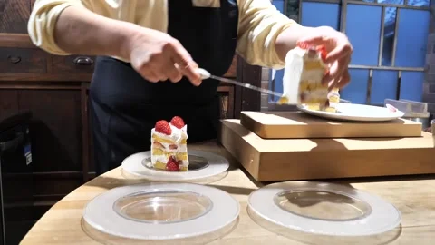 Pastry Chef Plating Slices of Strawberry Cake Stock Footage 340900853